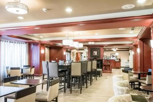 a dining room with tables and chairs at Hampton Inn Montgomery-South-Airport in Hope Hull