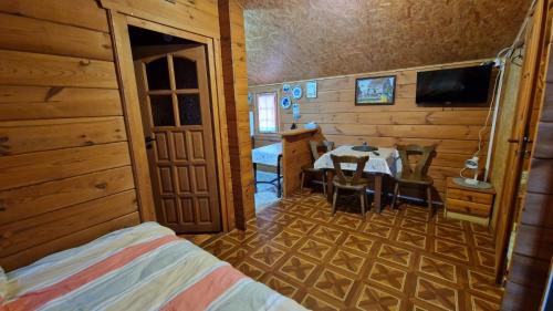 a room with a table and a dining room at Przystań wodnica in Ustka