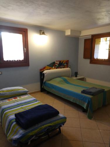 Ένα ή περισσότερα κρεβάτια σε δωμάτιο στο Casa di Giò