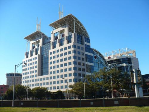 a tall building with two towers on top of it at Homewood Suites by Hilton Mobile Airport-University Area in Mobile