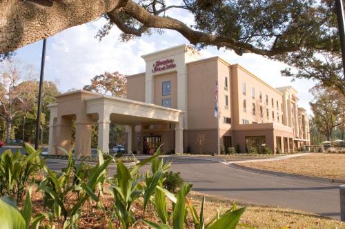 a building on a street in front of a building at Hampton Inn & Suites Mobile Providence Park/Airport in Mobile