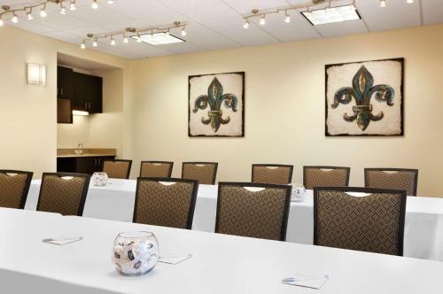 a conference room with white tables and chairs at Hampton Inn Slidell in Slidell