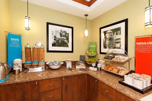 a kitchen with a counter with food on it at Hampton Inn by Hilton Montrose in Montrose