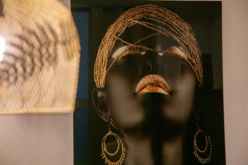 a bust of a woman wearing a headdress with her eyes closed at Amelia Apts & Rooms in Alghero