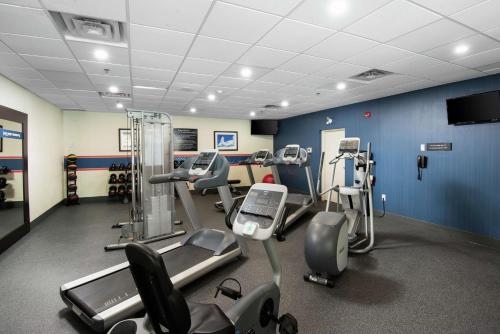 a gym with several cardio machines in a room at Hampton Inn & Suites by Hilton Barrie in Barrie