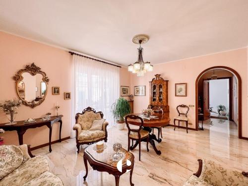 a living room filled with furniture and a table at Borgo Antico in Atessa