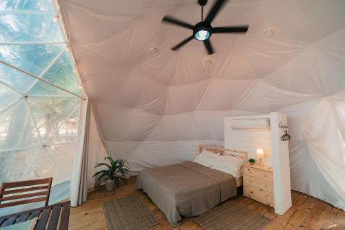 Postel nebo postele na pokoji v ubytování Cupulas Dominicana