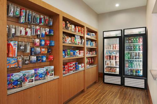 a grocery store aisle with shelves of food and drinks at Homewood Suites University City Philadelphia in Philadelphia