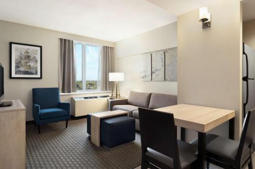 a living room with a couch and a table at Homewood Suites University City Philadelphia in Philadelphia