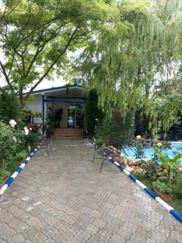 a patio with blue and white tape around it at Hotel Vila Alex in Costinesti