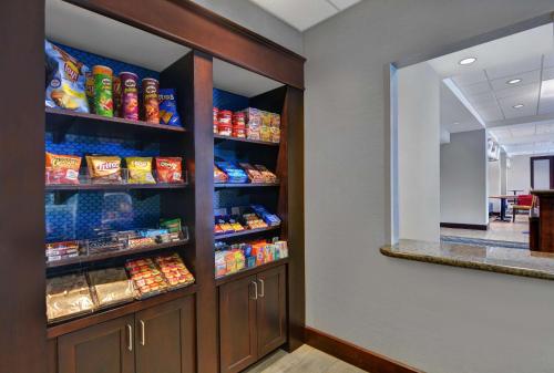 a walk in pantry with a refrigerator filled with food at Hampton Inn Bath - Brunswick Area , ME in Bath
