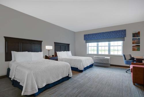 a hotel room with two beds and a window at Hampton Inn Bath - Brunswick Area , ME in Bath