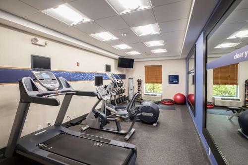 a gym with treadmills and cardio equipment in a room at Hampton Inn Freeport/Brunswick in Freeport