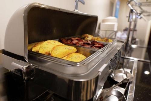 a food machine with pastries and other food items at Hampton Inn & Suites Raleigh Cary Lenovo Center in Cary