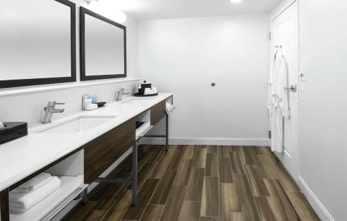 a bathroom with a sink and a shower at Hampton Inn & Suites Raleigh Cary Lenovo Center in Cary