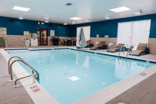 a large swimming pool in a hotel room at Hampton Inn Rehoboth Beach in Rehoboth Beach