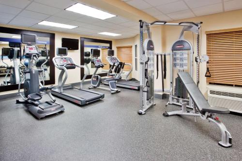 a gym with several treadmills and cardio machines at Hampton Inn & Suites Chapel Hill/Durham in Chapel Hill