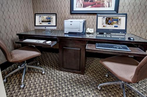 an office with a desk with a computer and two chairs at Hampton Inn Russellville in Russellville