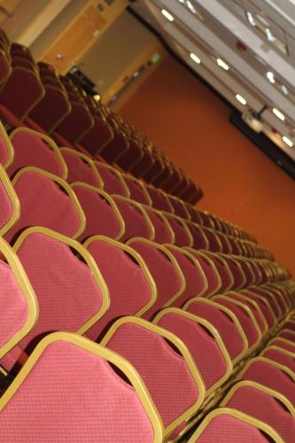 a row of red seats in an auditorium at Hampton Inn & Suites Folsom in Folsom