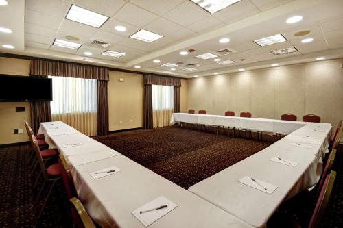 a conference room with a long table and chairs at Hampton Inn & Suites Folsom in Folsom