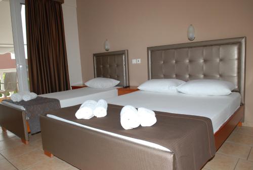 Ένα ή περισσότερα κρεβάτια σε δωμάτιο στο John & Eve Hotel