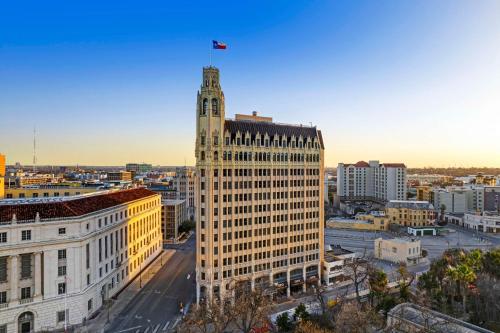 a tall building with a flag on top of it at The Emily Morgan Hotel - A DoubleTree by Hilton in San Antonio