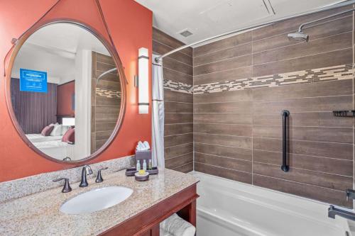 a bathroom with a sink and a mirror at The Emily Morgan Hotel - A DoubleTree by Hilton in San Antonio