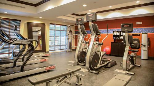a gym with several treadmills and elliptical machines at Hampton Inn Matamoras in Matamoras