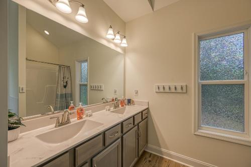a bathroom with two sinks and a large mirror at Castaway Cove in Mineral