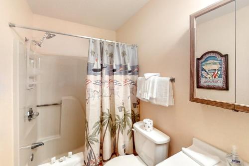 a bathroom with a toilet and a shower curtain at Golf Colony at Deerfield 26H in Myrtle Beach