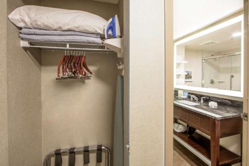a bathroom with a sink and a bunk bed in a room at Hampton Inn & Suites Seattle-Downtown in Seattle