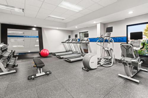 a gym with several treadmills and exercise machines at Hampton Inn Seekonk in Seekonk
