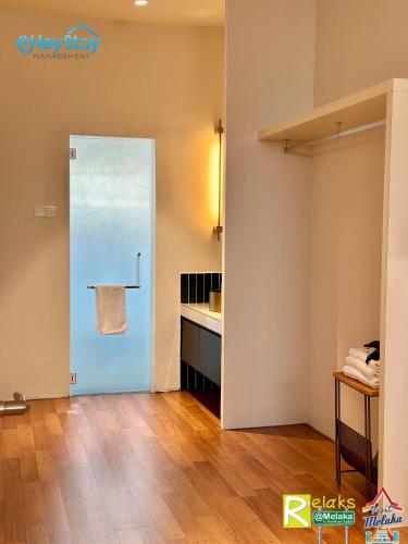 a room with a blue door and a counter at JonkerHeritage House WalkingDistance10minsJonker By Heystay Management in Malacca