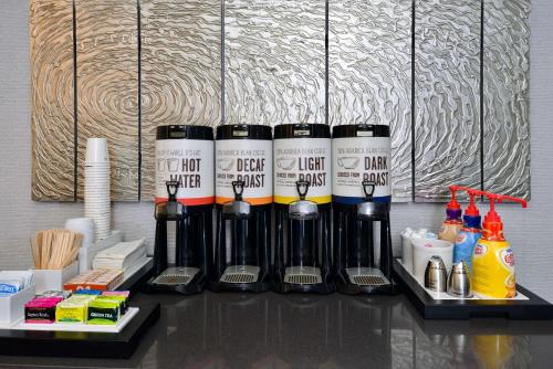 a group of bottles of wine sitting on a table at Hampton Inn San Francisco - Daly City in Daly City