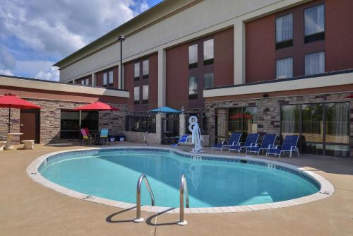 a large swimming pool in front of a hotel at Hampton Inn South Hill in South Hill