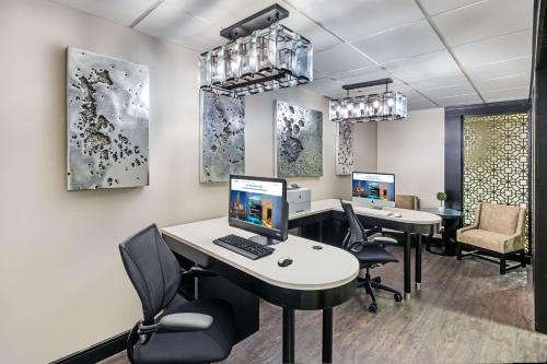 an office with two desks with computers on them at Homewood Suites by Hilton Shreveport in Shreveport
