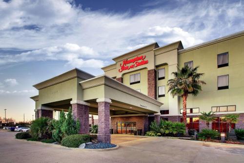 a hotel with a sign on the front of it at Hampton Inn & Suites Shreveport in Shreveport