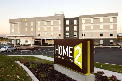 a sign in front of a home two story building at Home2 Suites by Hilton West Valley City in West Valley City