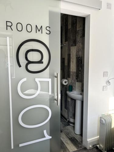 a bathroom with a toilet and a sink at Rooms Kingswood in Bristol