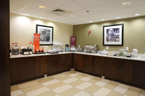 a waiting room with a counter in a store at Hampton Inn Sumter in Sumter