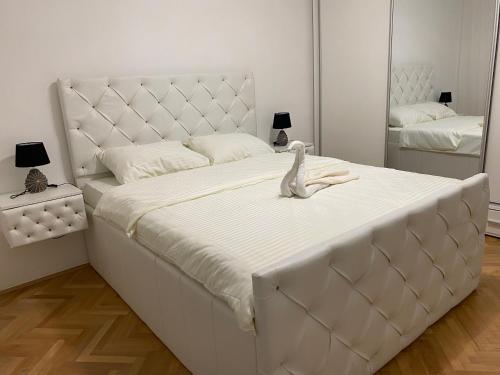 Postel nebo postele na pokoji v ubytování Apartman Oaza