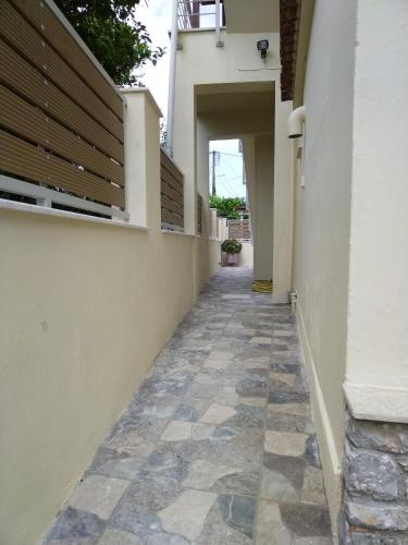 a hallway of a house with a tile floor at Pansion Matoula in Skiathos Town