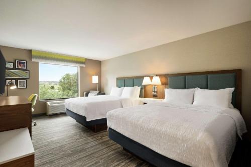 a hotel room with two beds and a window at Hampton Inn & Suites Tacoma/Puyallup in Puyallup