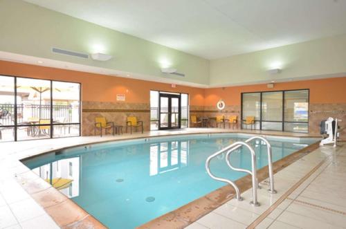 a large swimming pool in a hotel room at Hampton Inn and Suites Tulsa/Catoosa in Catoosa