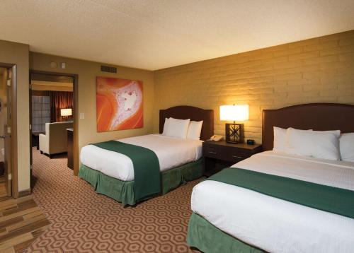 a hotel room with two beds and a room with at DoubleTree Suites by Hilton Tucson-Williams Center in Tucson