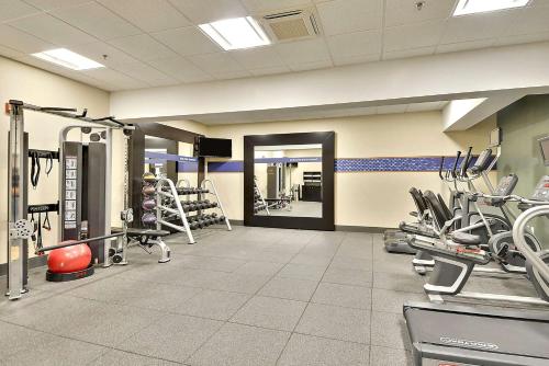 a gym with treadmills and machines in a room at Hampton Inn Alexandria/Old Town in Alexandria