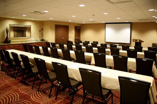 a conference room with a long table and chairs at Hampton Inn Waynesburg in Waynesburg