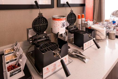a kitchen counter with two cooking utensils on it at Hampton Inn Los Angeles-West Covina in West Covina