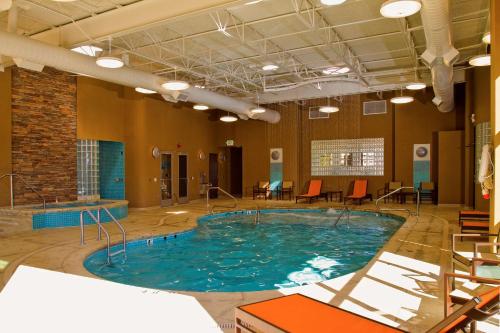 a large swimming pool in a large room with chairs at Hampton Inn Wheeling in Wheeling