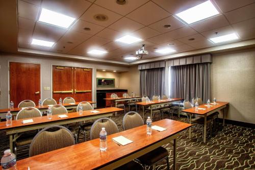 a conference room with wooden tables and chairs at Hampton Inn Wheeling in Wheeling